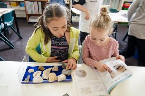 Children researching fossils.